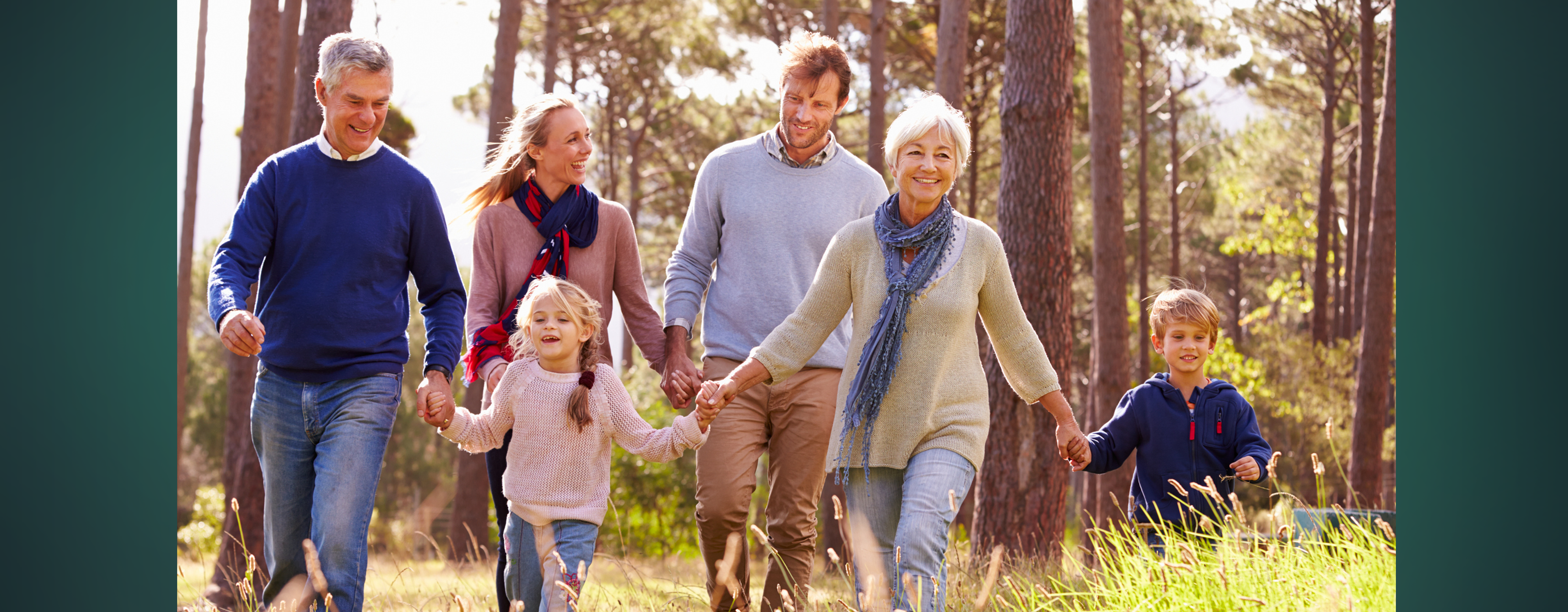 A multi-generational family walking outdoors together