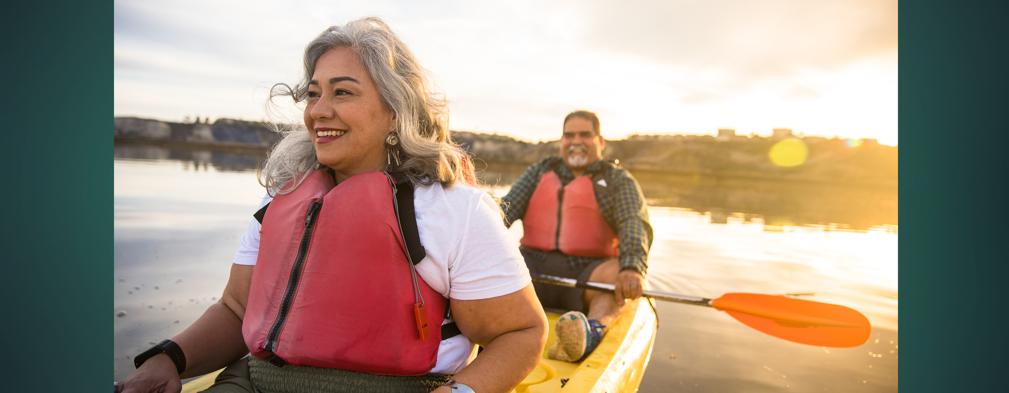 A couple canoeing together on a lake
