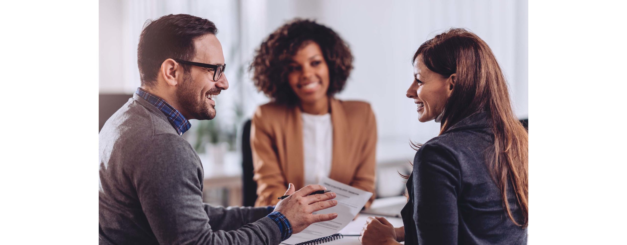 A couple meeting with their financial advisor