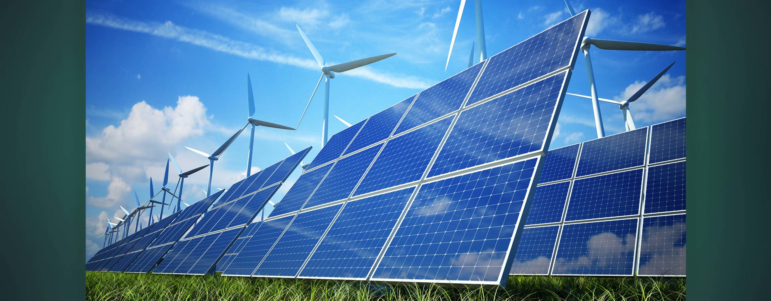 A photo of several solar panels and windmills