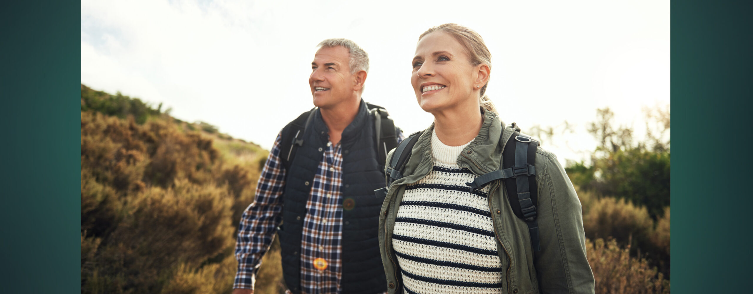 A couple hiking together in the fall