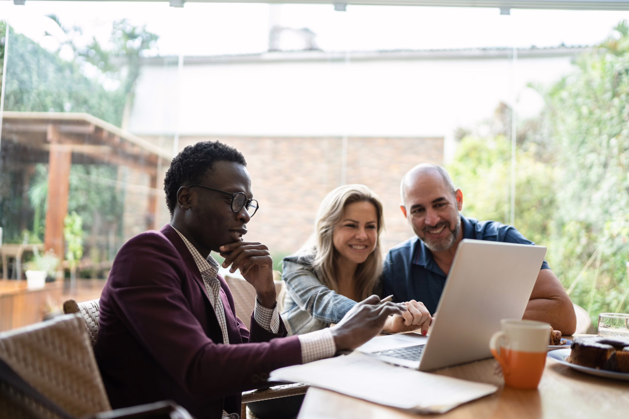 A couple meeting with their financial advisor to discuss IRAs